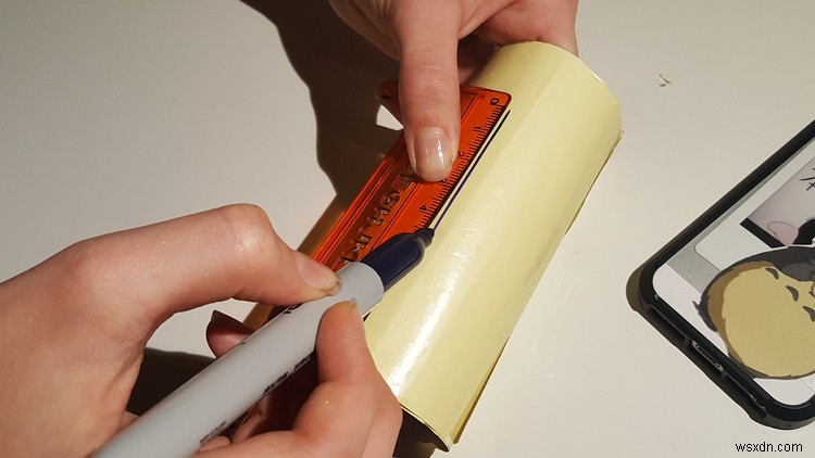 How to make a cheap iPhone stand using only a toilet roll and some pins