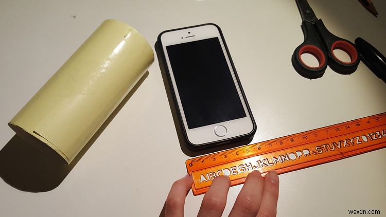 How to make a cheap iPhone stand using only a toilet roll and some pins